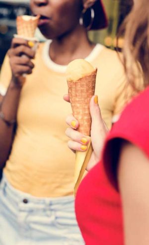 group-of-diverse-women-eating-ice-cream-together-2022-12-16-00-12-32-utc